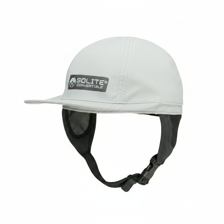 White surf hat with a black strap on a white background, featuring the &