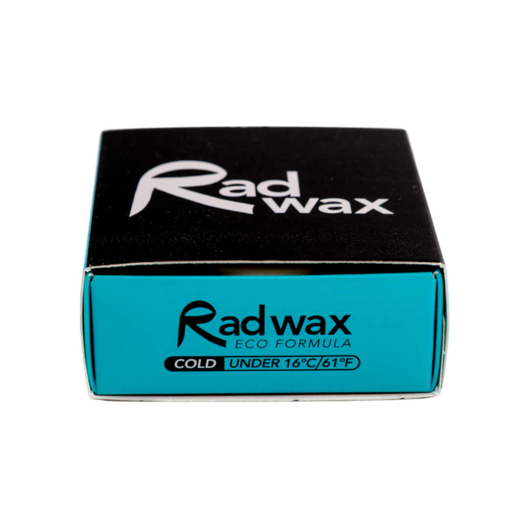 A square product box for Radwax Eco Formula Cold Wax, featuring a black top half with a white logo and a bright turquoise-blue bottom half with black text, set against a plain white background.