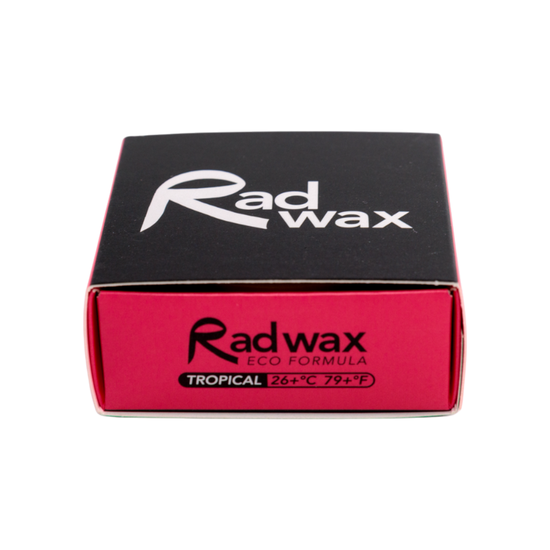 A square black and red box of Rad wax Eco Formula Tropical, featuring the brand name &