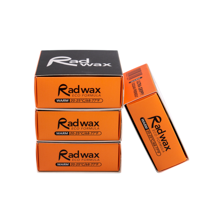 Three orange and black Radwax LCO Formula wax boxes stacked vertically, with one box leaning against the right side, on a plain white background.
