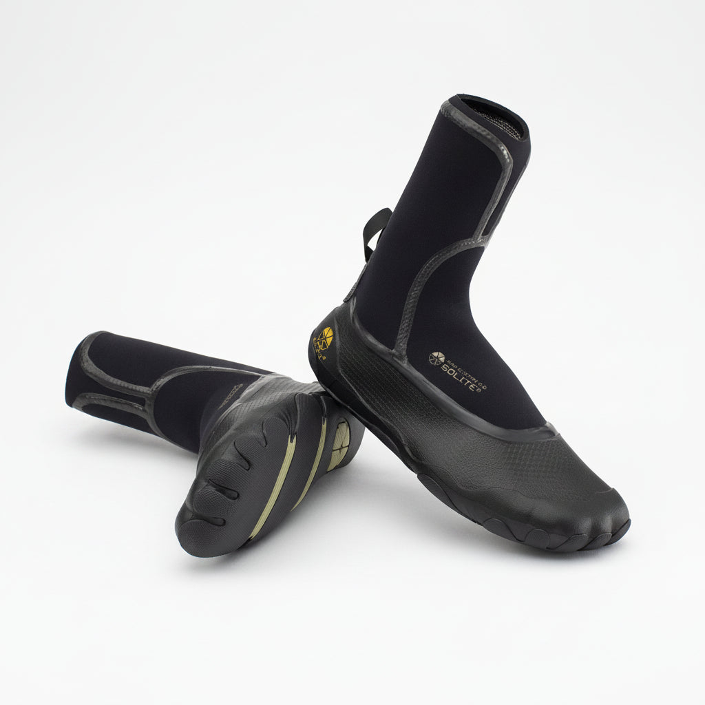 Pair of black surfing boots on a white background