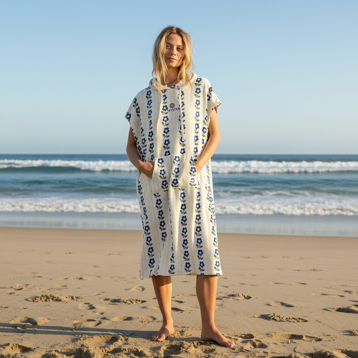 Woman waring towel robe on beach